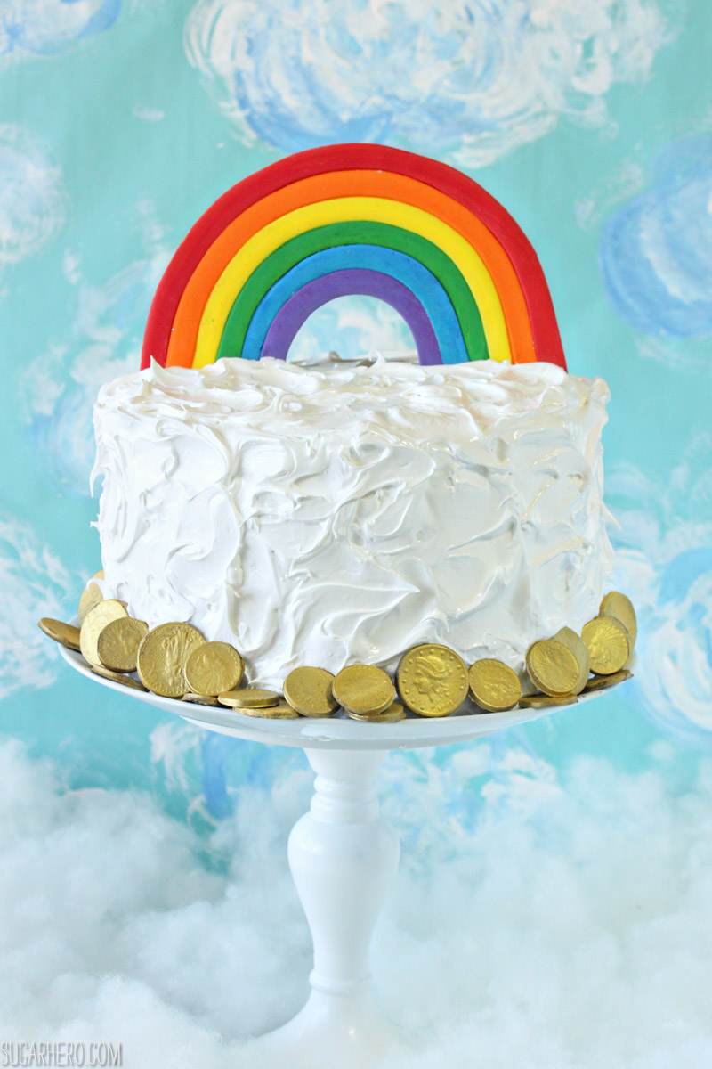 Rainbow in the Clouds Cake - with rainbow buttercream and fluffy cloud frosting | From SugarHero.com
