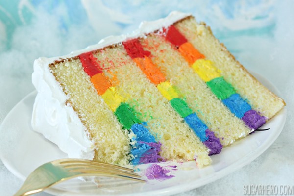 Rainbow in the Clouds Cake - with rainbow buttercream and fluffy cloud frosting | From SugarHero.com