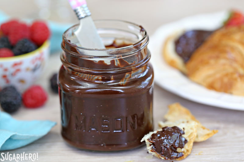 Lick-The-Knife-Clean Chocolate Spread - A straight shot of the mason jar with chocolate spread in it. | From SugarHero.com