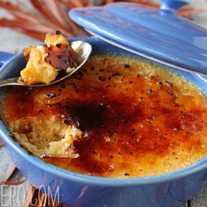 Bowl of Rice Pudding Brûlée with a spoon holding a bite.