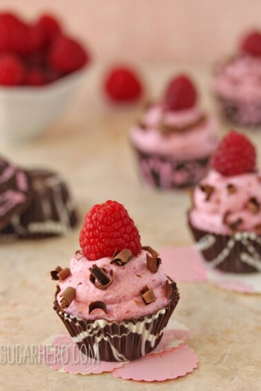Several Raspberry Mousse Chocolate Cups on a countertop.