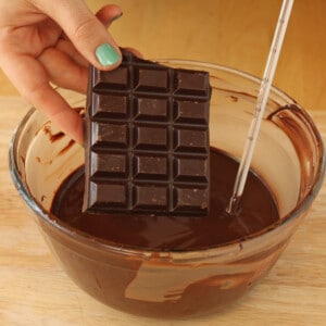 Image of chocolate bar melting into warm chocolate.