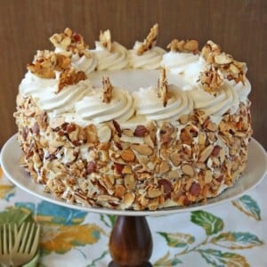 Close up of a Burnt Almond Cake on a cake stand.