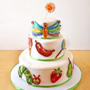 Close up of the Very Hungry Caterpillar Cake with fondant designs.