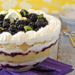 Side view of Lemon Blackberry Trifle in a trifle bowl.