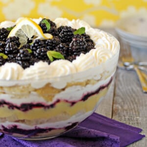 Side view of Lemon Blackberry Trifle in a trifle bowl.