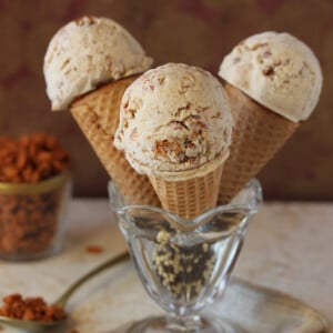 3 Cinnamon Crunch Ice Cream Cones in a glass dessert dish.