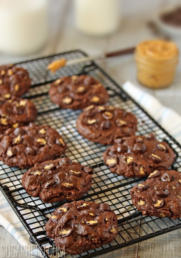 Gooey chocolate peanut butter cup cookies are intensely chocolatey cookies with a gooey center and lots of miniature peanut butter cups! | SugarHero.com Gooey Chocolate Peanut Butter Cup Cookies | SugarHero.com