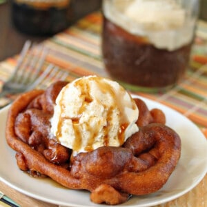 A Deep Fried Root Beer Float on plate with a big scoop of ice cream.