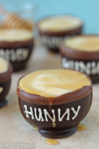 Close up of a Chocolate Hunny Pot with Honey Mousse dripping honey down the front.