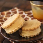 2 Salted Caramel Ice Cream Sandwiches on a small brown plate.