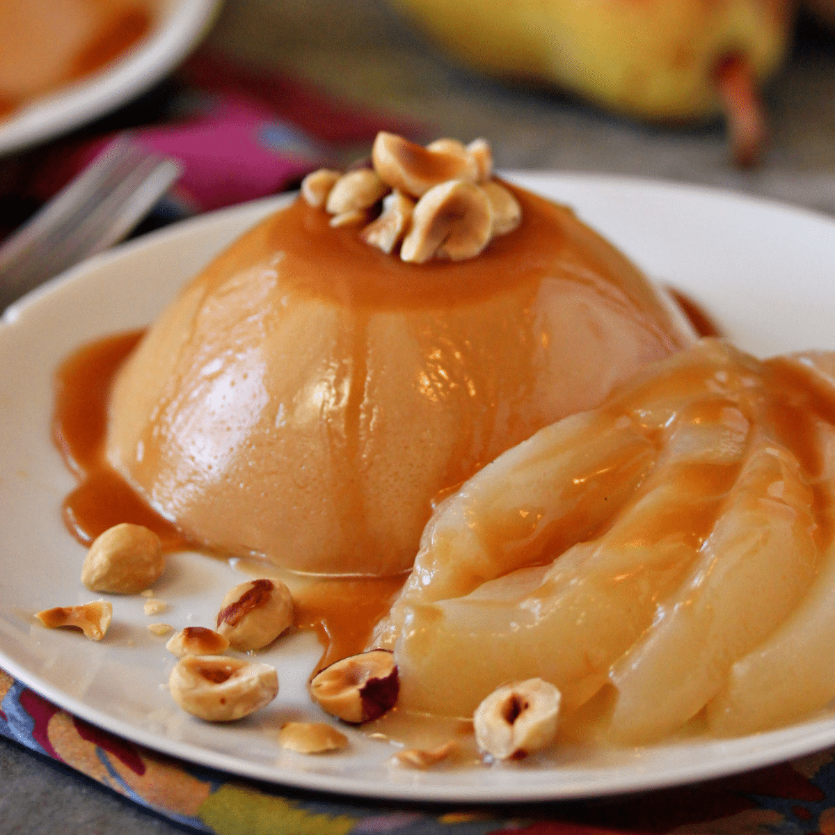 Close up of Caramel Panna Cotta with Poached Pears.