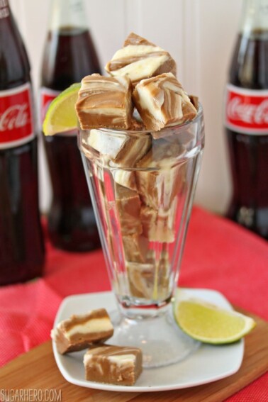 Tall glass filled with slices of Dirty Coke Fudge.