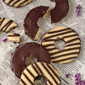 Fudge-Striped Shortbread Cookies on a piece of newspaper.