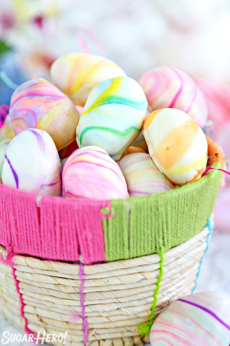 Pile of Marbled Easter Egg Truffles in a woven Easter basket.