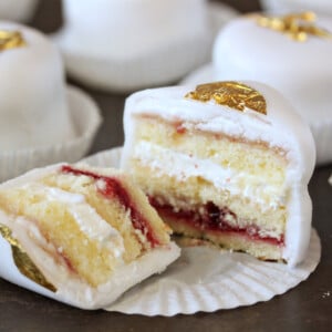 Close up of a Basic Petit Four that is cut open to show the interior layers.