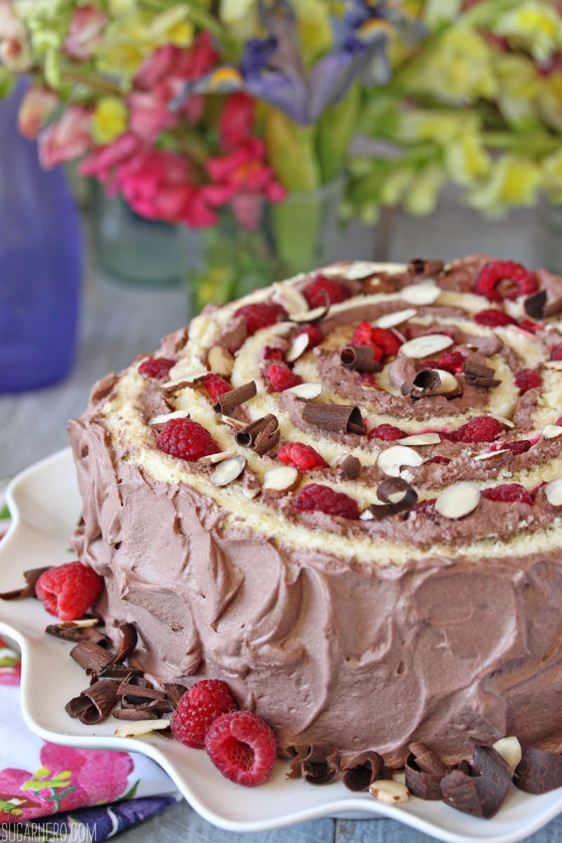 Raspberry Almond Spiral Cake - almond cake, chocolate whipped cream, and berries, rolled into a spiral! | From SugarHero.com
