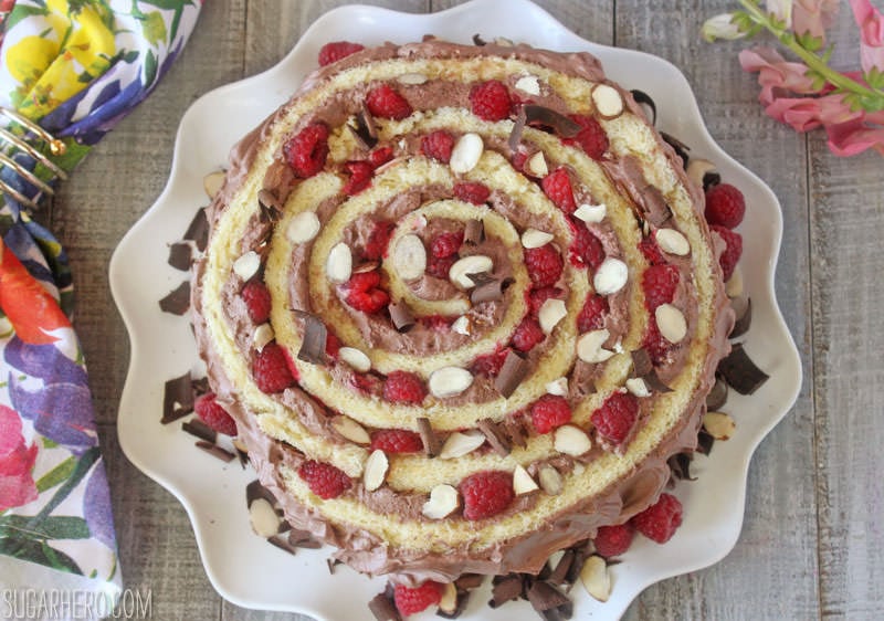 Raspberry Almond Spiral Cake | From SugarHero.com Raspberry Almond Spiral Cake - almond cake, chocolate whipped cream, and berries, rolled into a spiral! | From SugarHero.com
