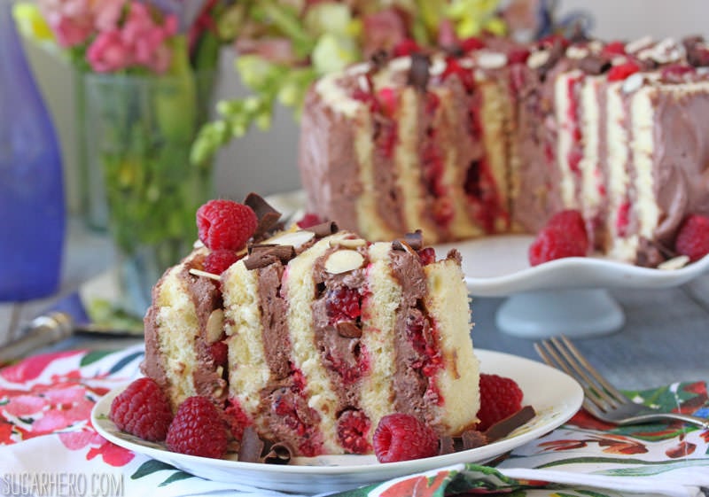 Raspberry Almond Spiral Cake - almond cake, chocolate whipped cream, and berries, rolled into a spiral! | From SugarHero.com