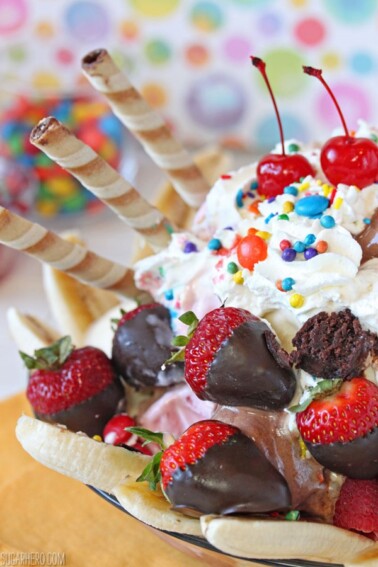 Close up of the side of an Ultimate Banana Split showing fruit, sprinkles and cookies.