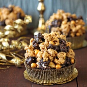 Close up of a Double Caramel Popcorn Brownie on a gold wrapper.