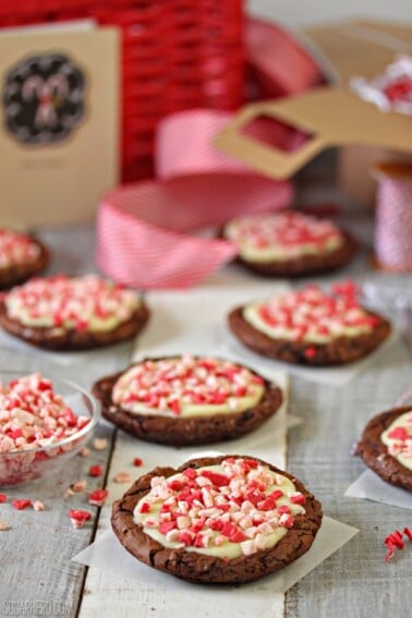 Chocolate Truffle Peppermint Crunch Cookies spaced out on a wooden surface.