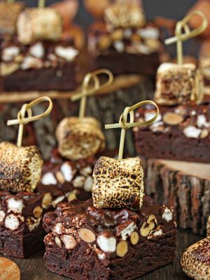 Close up of cut Campfire Rocky Road Brownies that are embellished with a toasted marshmallow.