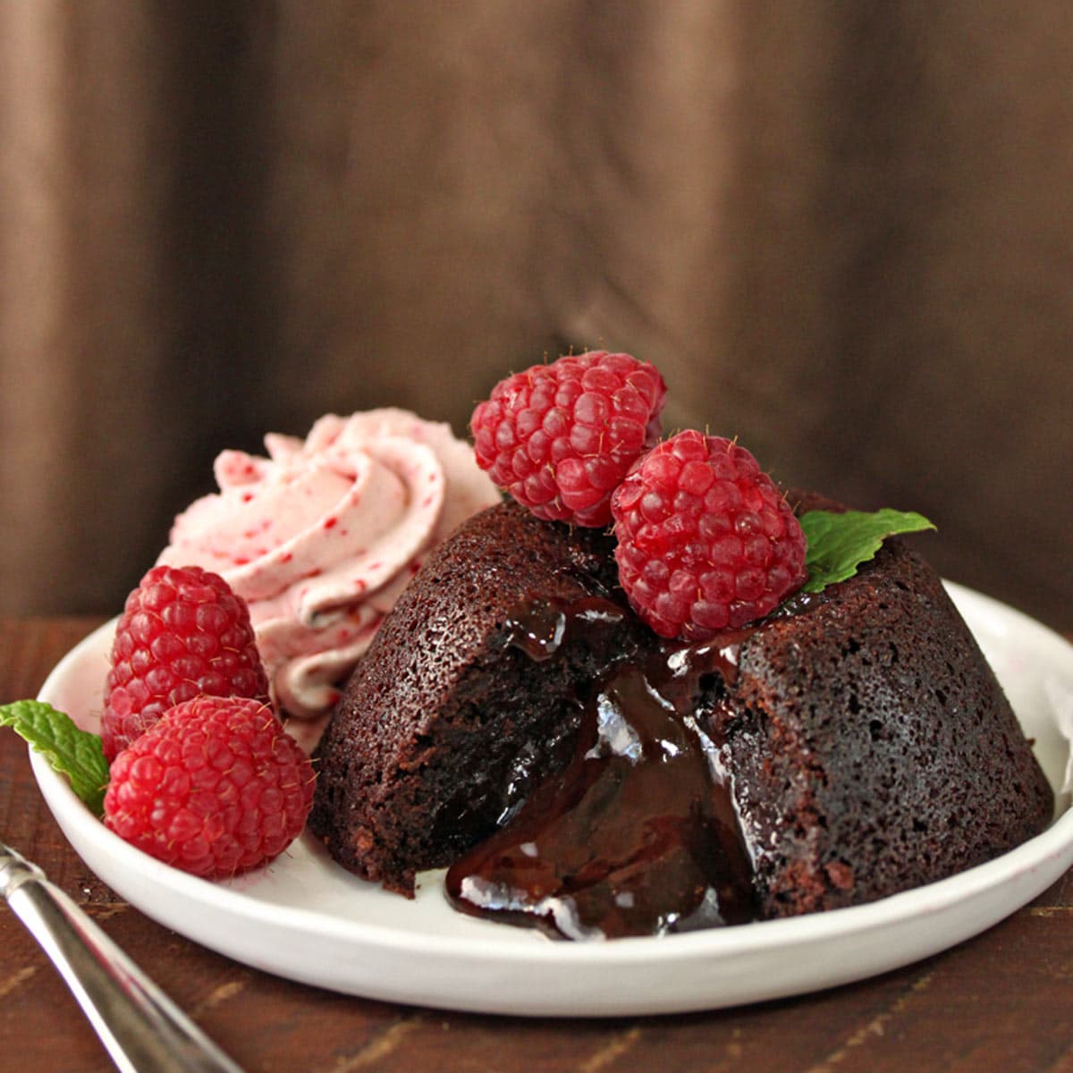 An easy lava cake made from ganache with fresh raspberries.