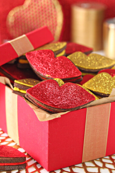 A small red gift box filled with Red Hot Love Cookies.