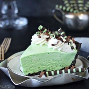 A slice of Fresh Mint Grasshopper Pie on a white plate.