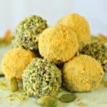 A pile of Pistachio and Orange Chocolate Truffles.