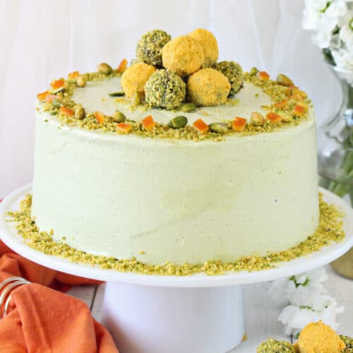 Close up of the Pistachio Orange Cake on a white cake platter.