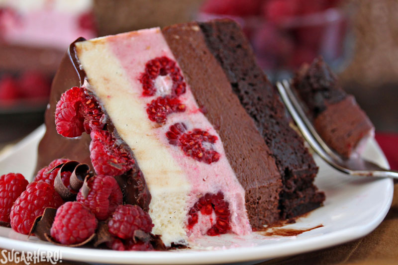 Chocolate Raspberry Mousse Cake - A piece of cake with a bite taken out of it. | From SugarHero.com