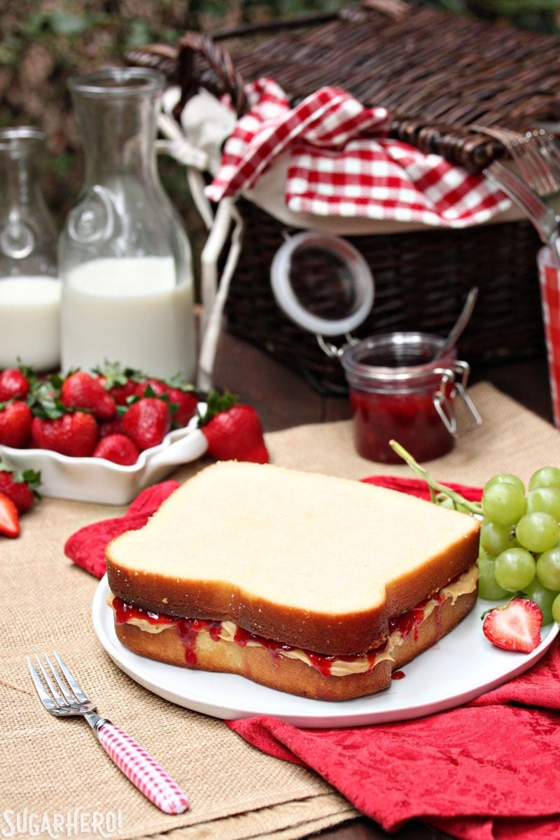 Peanut Butter and Jelly Sandwich Cake - made with pound cake and peanut butter frosting! | From SugarHero.com