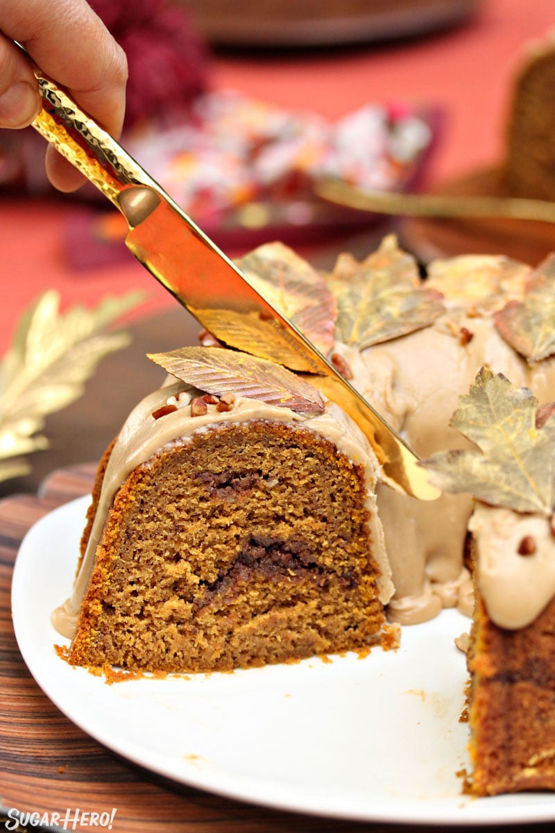 Gold knife slicing off a piece of Pumpkin Pound Cake.