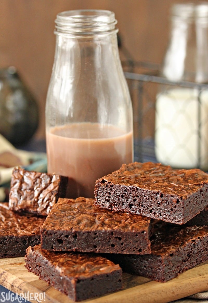 Ultimate Fudgy Chocolate Brownies - brownies on a plate with chocolate milk | From SugarHero.com