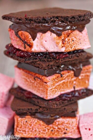 3 stacked Cranberry S'mores with a bite removed from the top s'more showing texture.