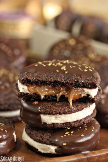 3 Spicy Chocolate Caramel Sandwich Cookies stacked vertically with bite removed from top cookie to show caramel center.