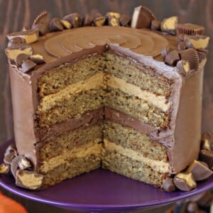 Close up of a Peanut Butter Cup Banana Cake with slices removed to show inner layers.