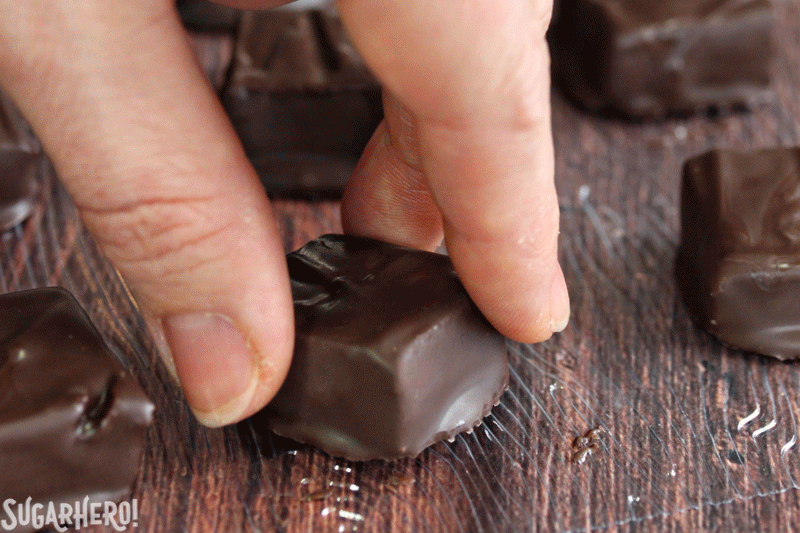 Rosemary Raspberry Truffles - moving gif of a hand turning over a chocolate from a texture sheet | From SugarHero.com