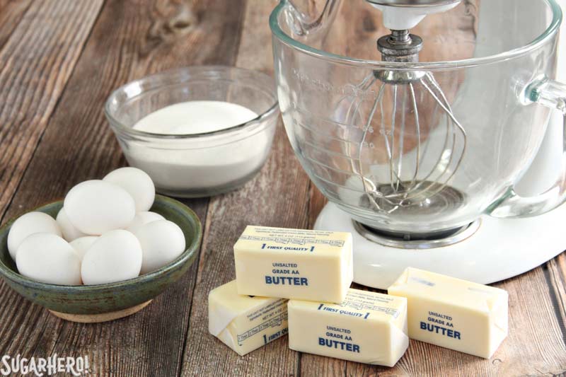 Swiss Meringue Buttercream is delicious, versatile, and the BEST frosting to use for layer cakes. Learn how to make it with this Swiss Meringue Buttercream recipe and photo tutorial! | From SugarHero.com How to Make Swiss Meringue Buttercream - A picture of eggs, butter, and sugar. | From SugarHero.com