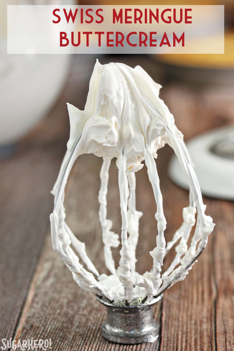 Swiss Meringue Buttercream is delicious, versatile, and the BEST frosting to use for layer cakes. Learn how to make it with this Swiss Meringue Buttercream recipe and photo tutorial! | From SugarHero.com How to Make Swiss Meringue Buttercream - A close up shot of buttercream on the wire whip. | From SugarHero.com