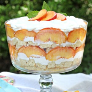 Close up of Peaches and Cream Trifle in a clear trifle bowl.