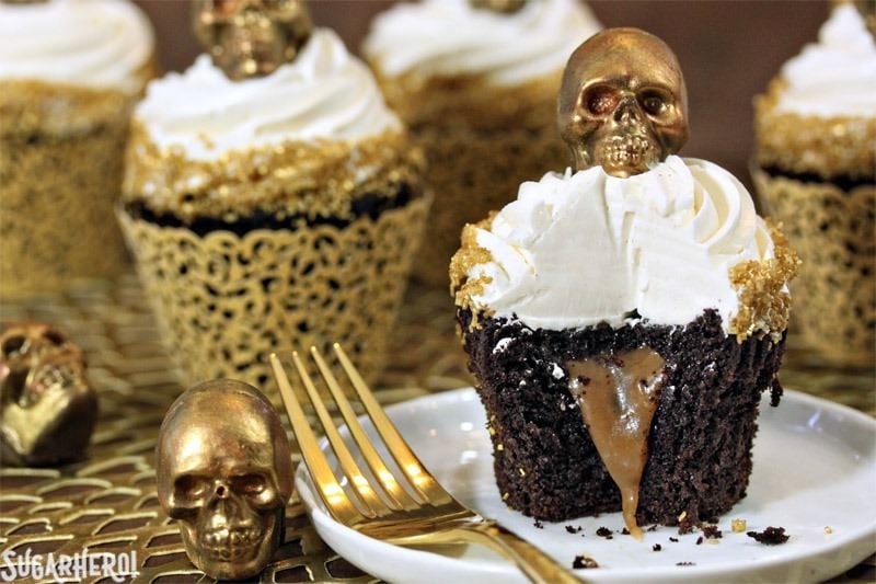 Caramel-Stuffed Chocolate Cupcakes with Caramel Skulls | From SugarHero.com