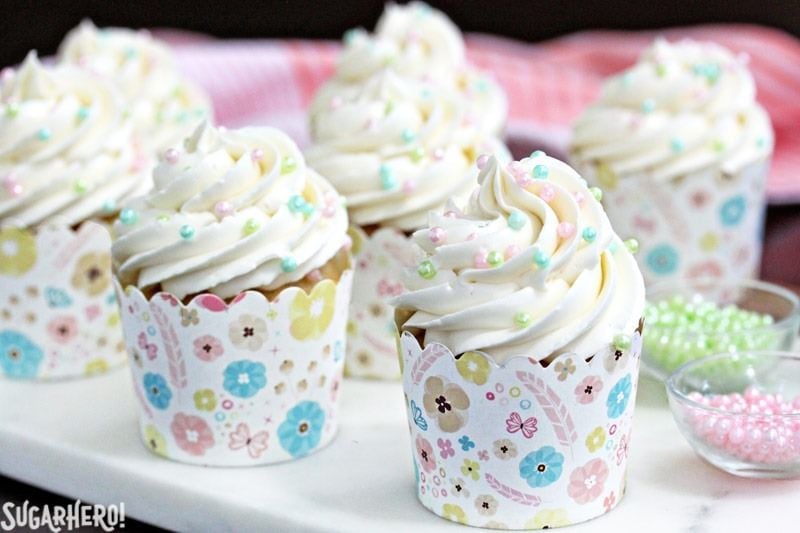 The Easiest Swiss Meringue Buttercream - A close up shot of cupcakes with piped buttercream. | From SugarHero.com