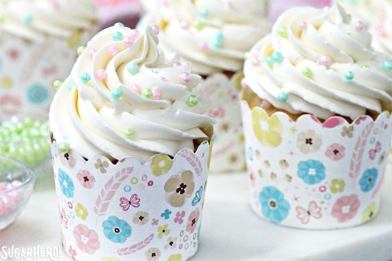 This is the Easiest Swiss Meringue Buttercream recipe you’ll ever make! Once you try it, you’ll want to use it to cover all of your cakes and cupcakes. | From SugarHero.com The Easiest Swiss Meringue Buttercream - A close up shot of a cupcake with piped buttercream. | From SugarHero.com