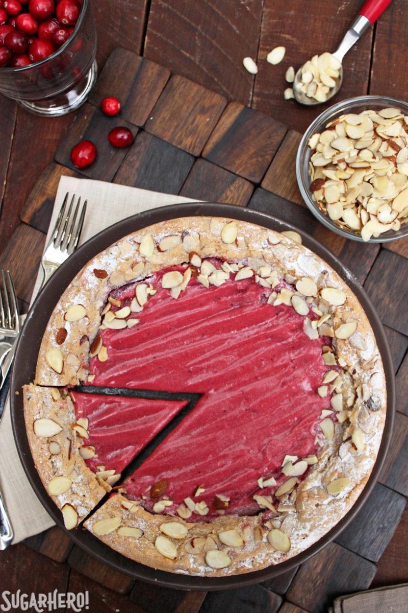 Cranberry Curd Almond Cake - a soft almond cake filled with sweet-tart cranberry curd. | From SugarHero.com Cranberry Curd Almond Cake | From SugarHero.com