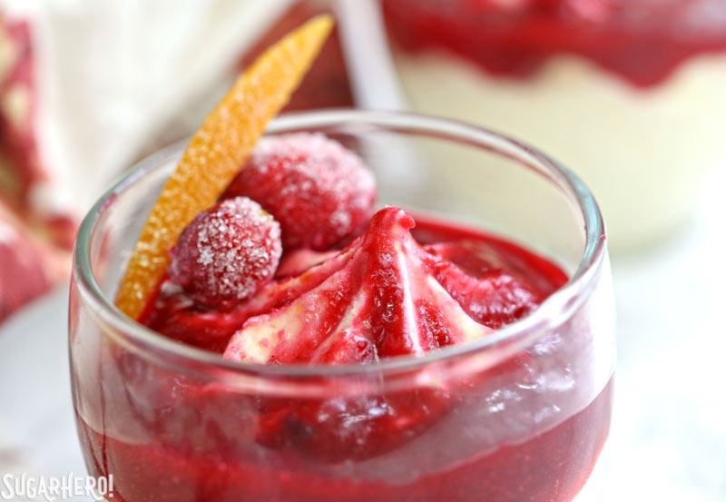 Orange Mousse with Cranberry Sauce - A close up shot of a mousse cup. | From SugarHero.com