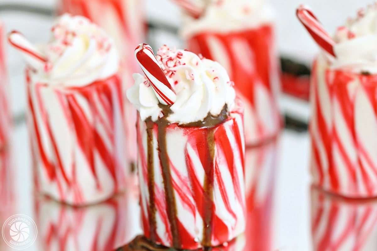 Candy Cane Cups - easy homemade candy cane shot glasses | From SugarHero.com Candy Cane Cups - easy homemade candy cane shot glasses | From SugarHero.com