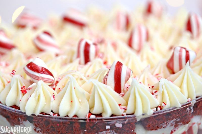 Close u of Red Velvet Trifle showing the piped frosting and peppermint pieces